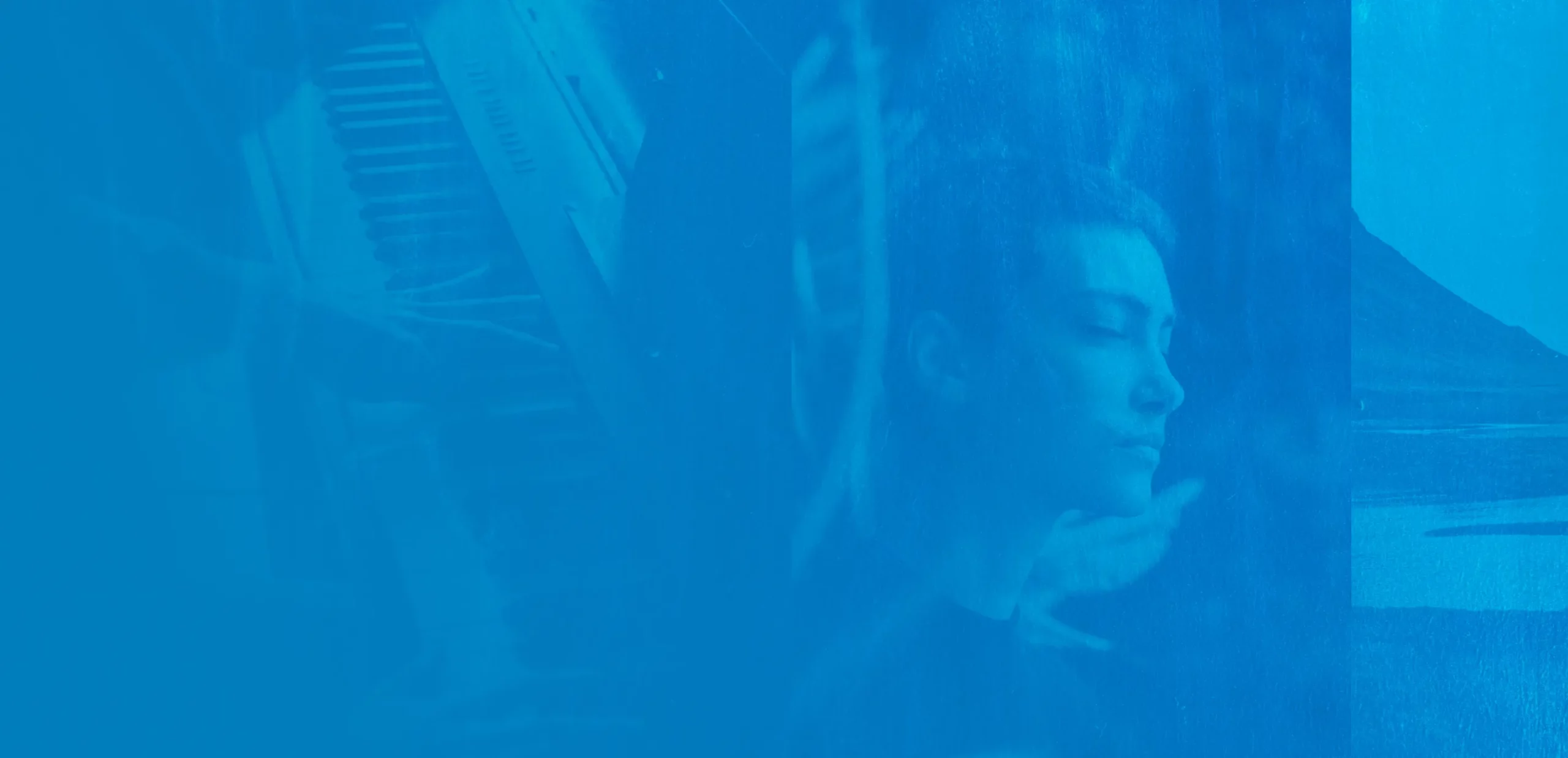 The banner at the top of the page has a blue filter. The banner image is of a young woman looking out of a window with her eyes closed. She seems deep in thought. She is white with cropped hair. 
